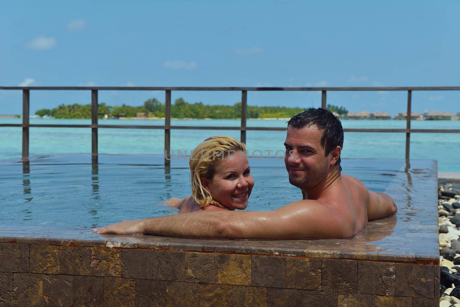 happy young  couple at summer vacation have fun and relax at beautiful sunny  day on beach