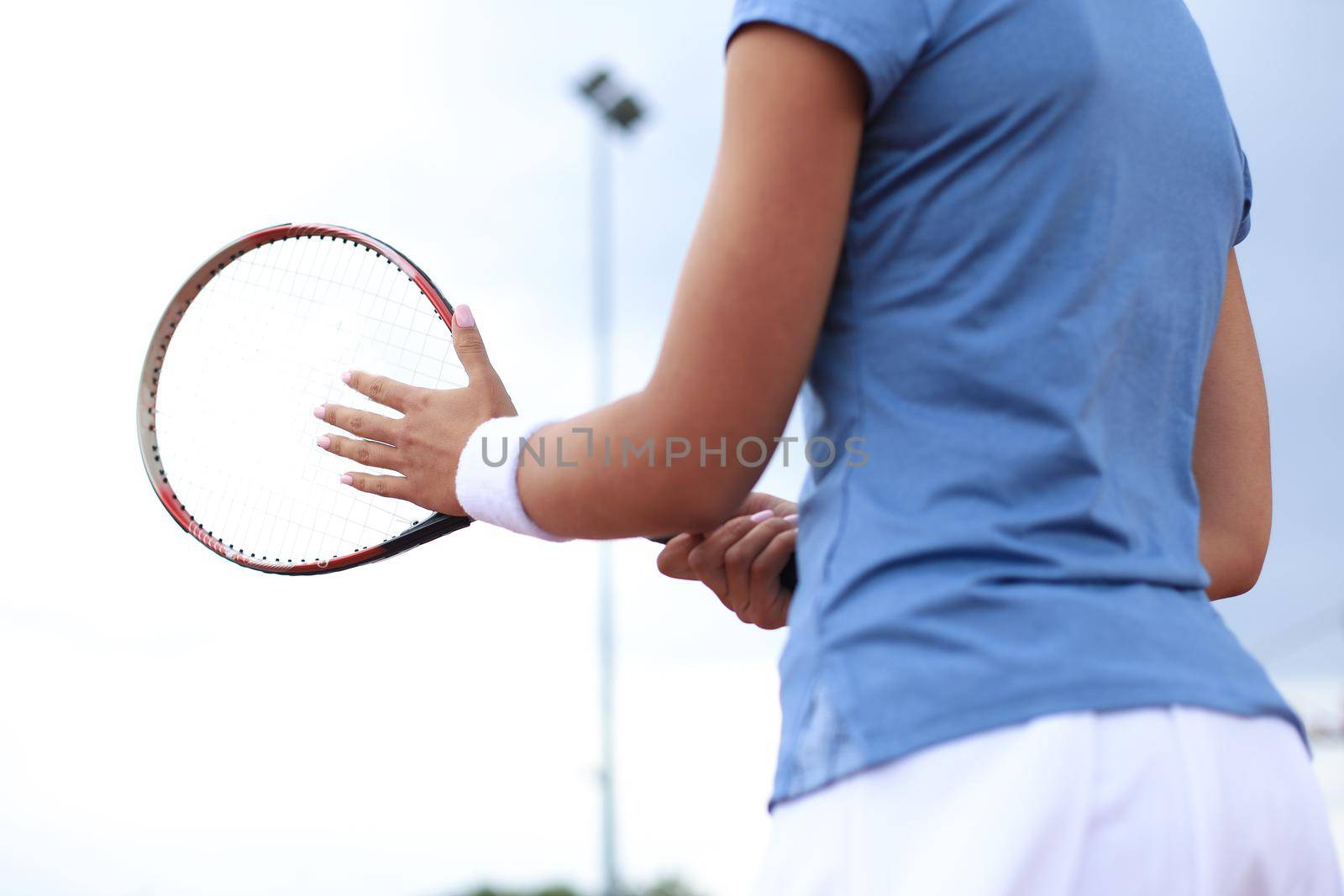 Sportswoman with racquet at the tennis court. Healthy lifestyle. by tsyhun