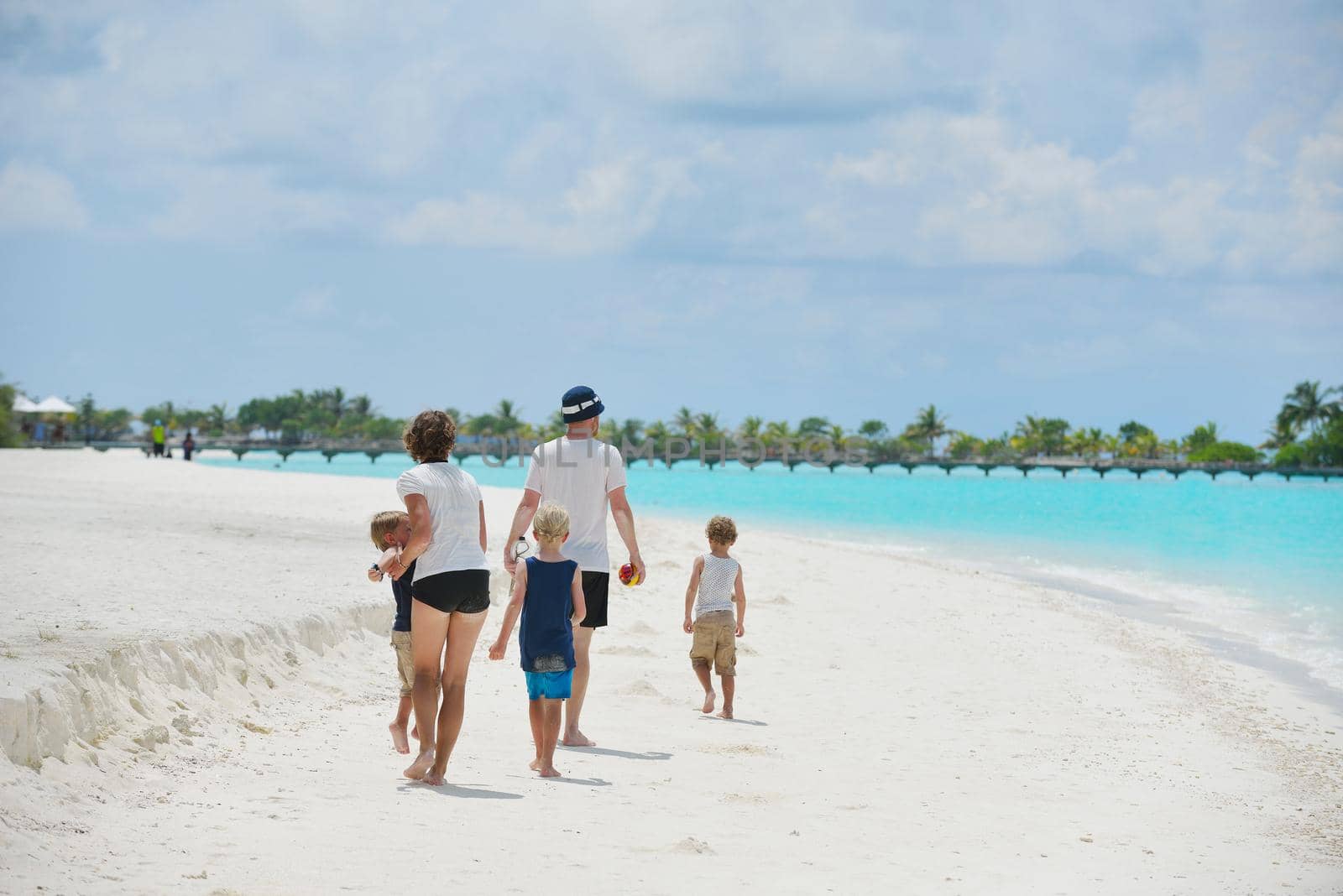 Portrait of a happy family on summer vacation  at beach