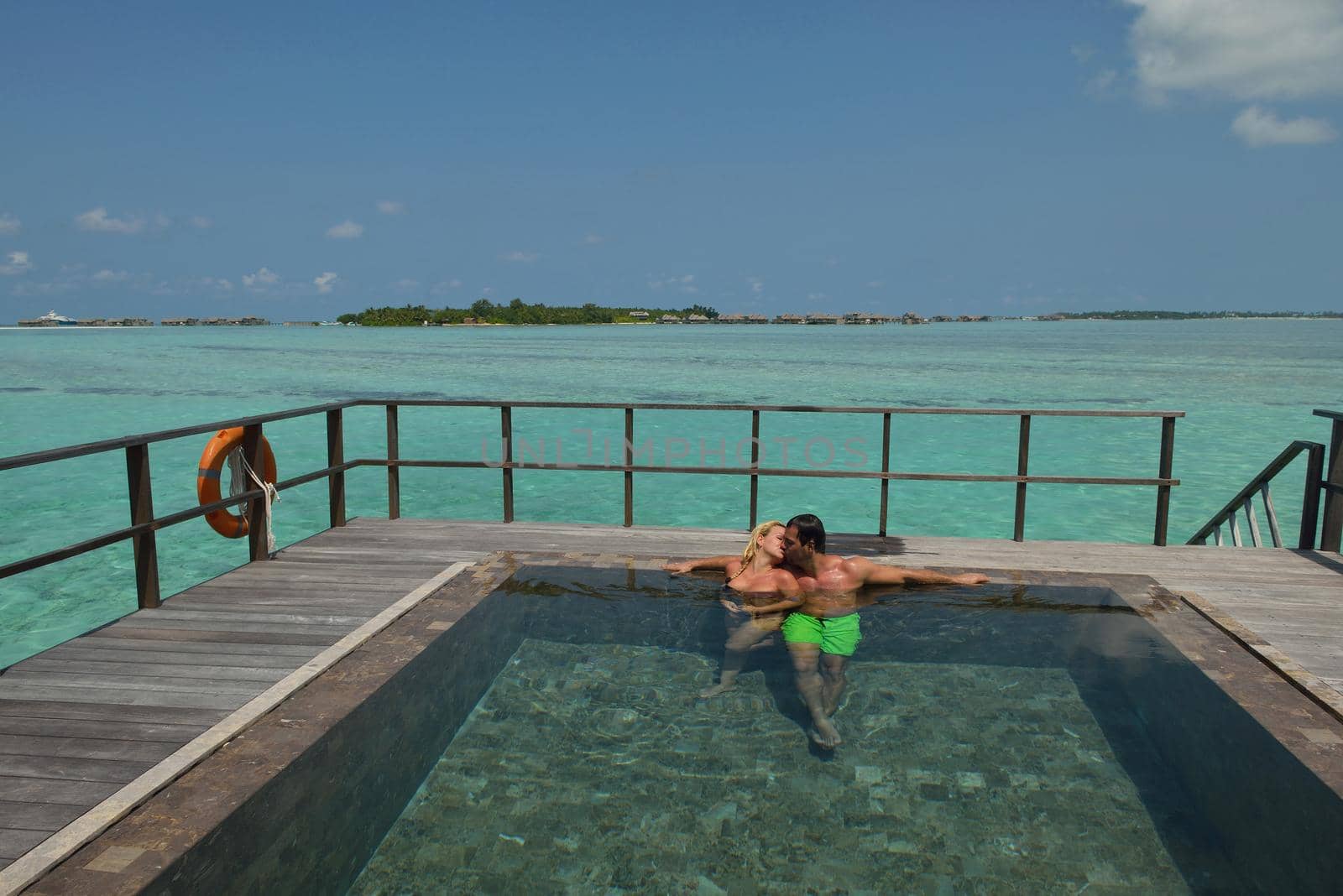 happy young  couple at summer vacation have fun and relax at beautiful sunny  day on beach