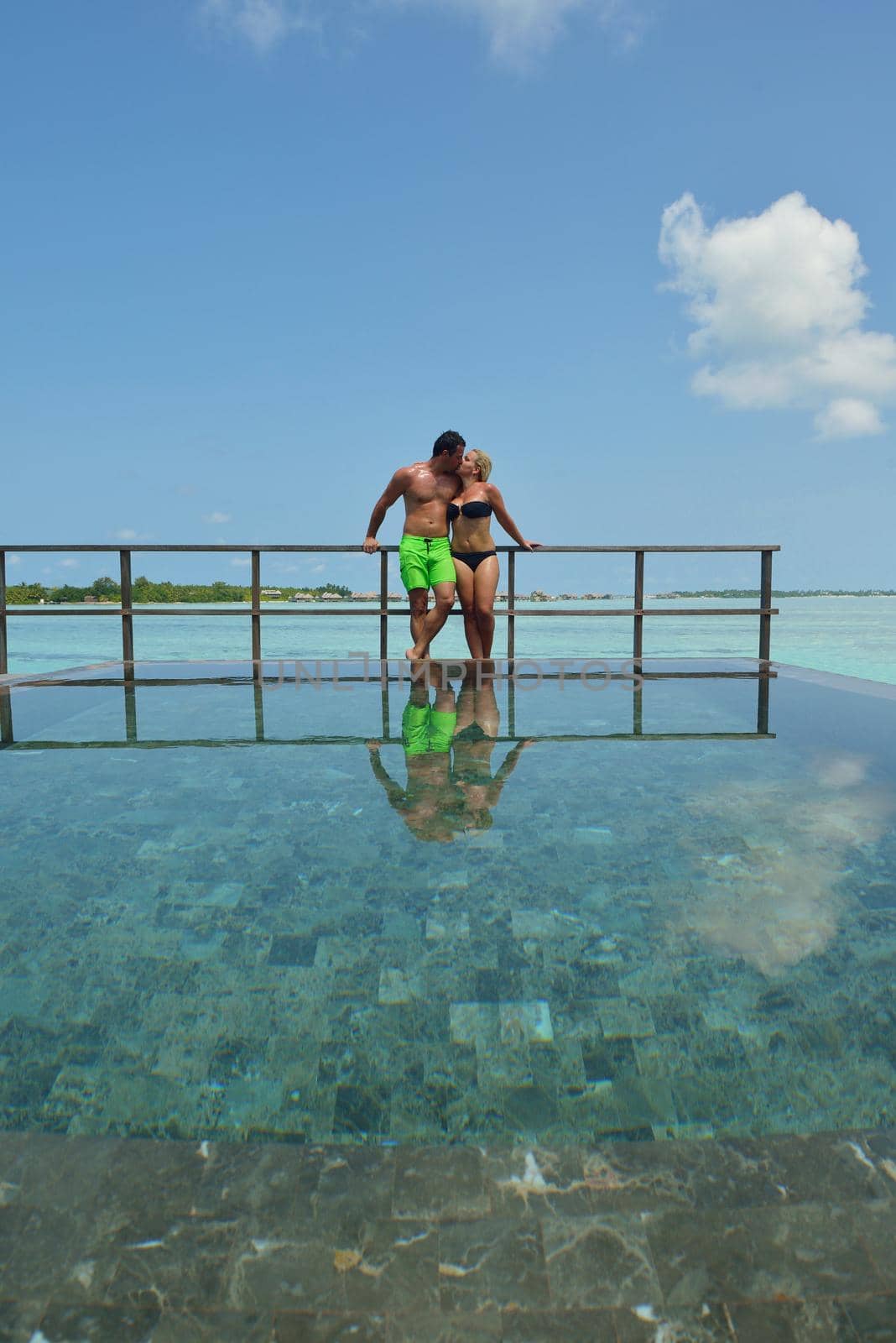 happy young  couple at summer vacation have fun and relax at beautiful sunny  day on beach