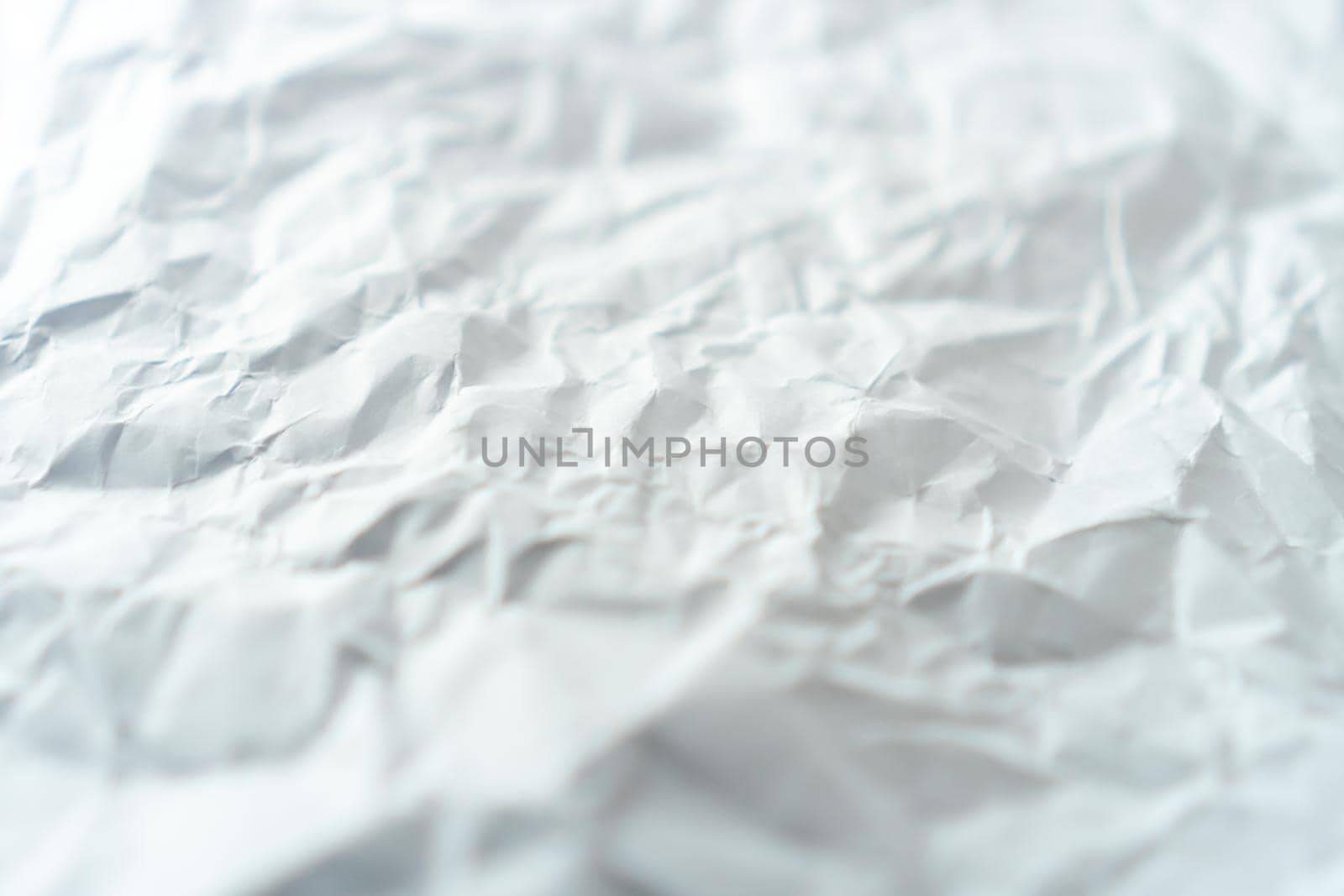 Top view of white crumpled paper texture. by Suwant