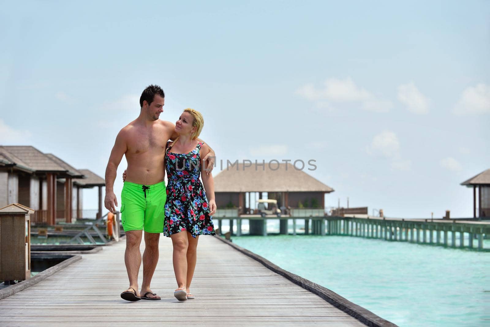 happy young  couple at summer vacation have fun and relax at beautiful sunny  day on beach