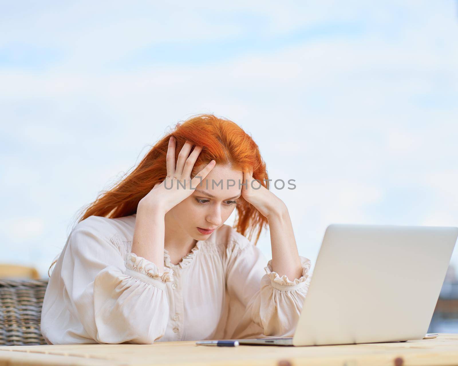 Coronavirus outbreak. Woman reading news about coronavirus and getting anxiety by NataBene