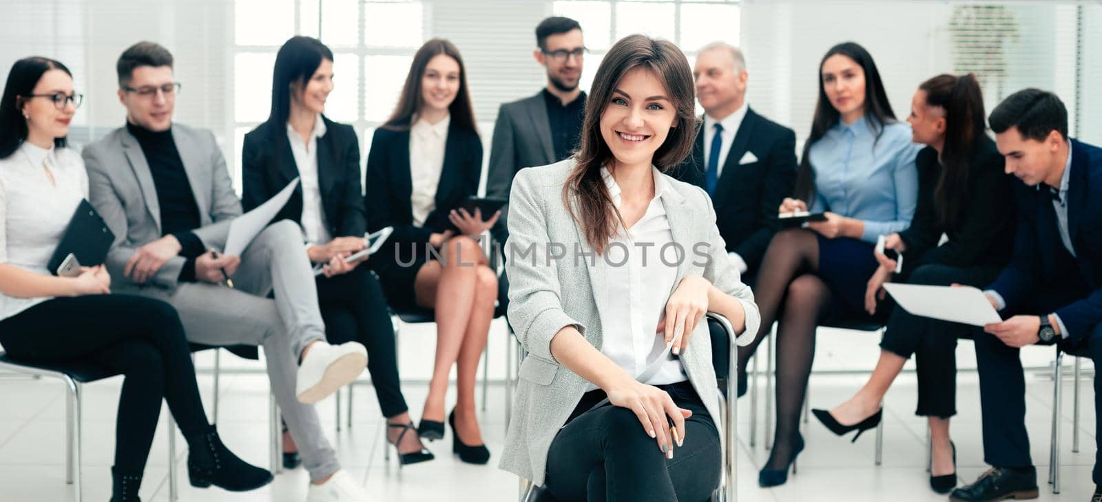 successful businesswoman and a group of leading experts in the conference room. photo with copy-space