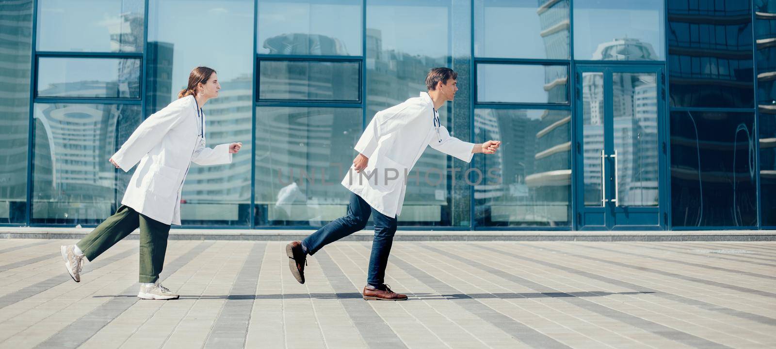 young doctors rush to an emergency call. by SmartPhotoLab