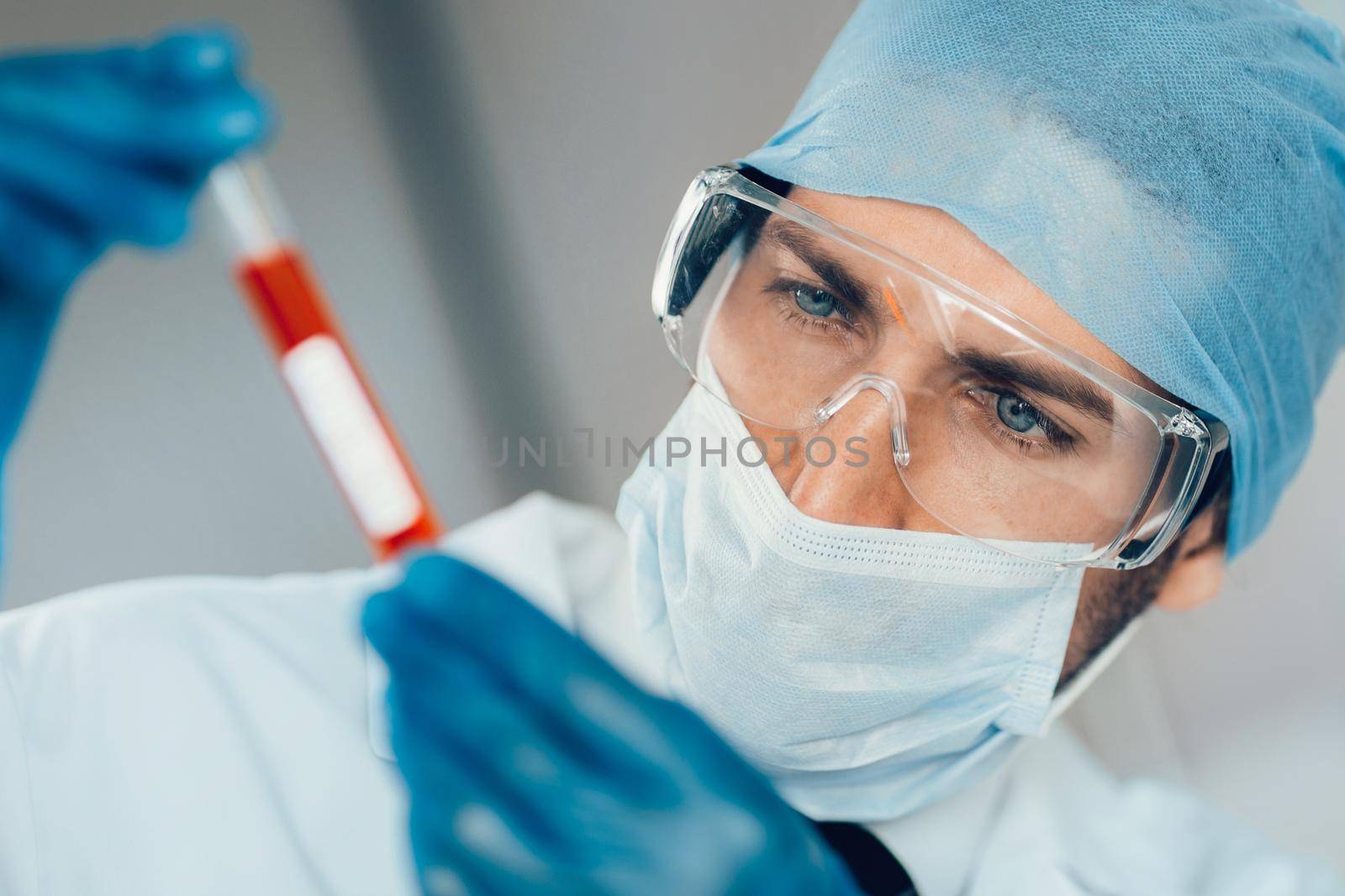 close up. test tube in the hands of a laboratory assistant. science and health.