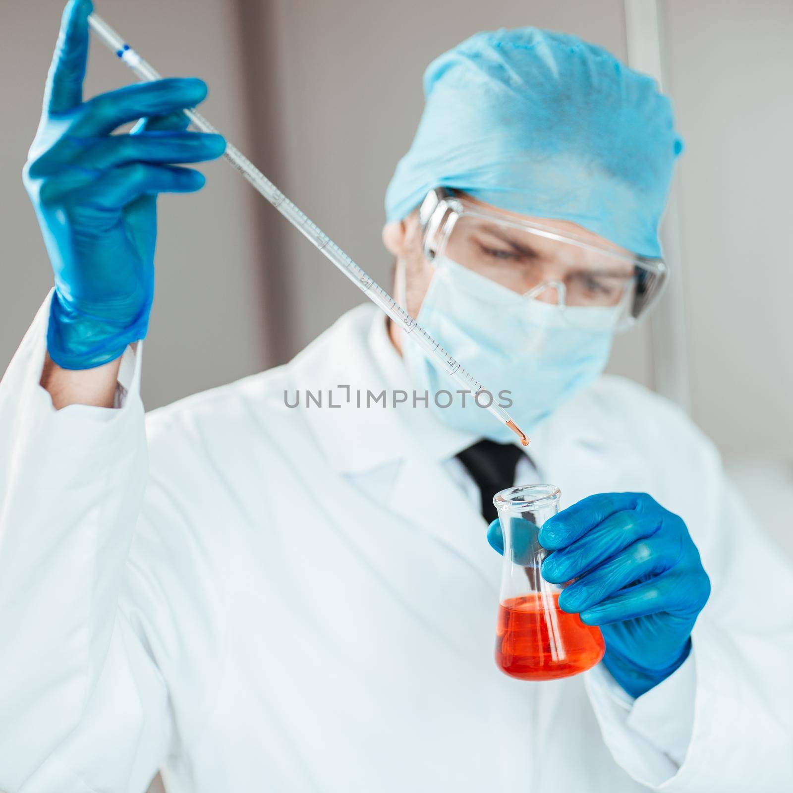 close up. scientist testing blood in the lab. by SmartPhotoLab