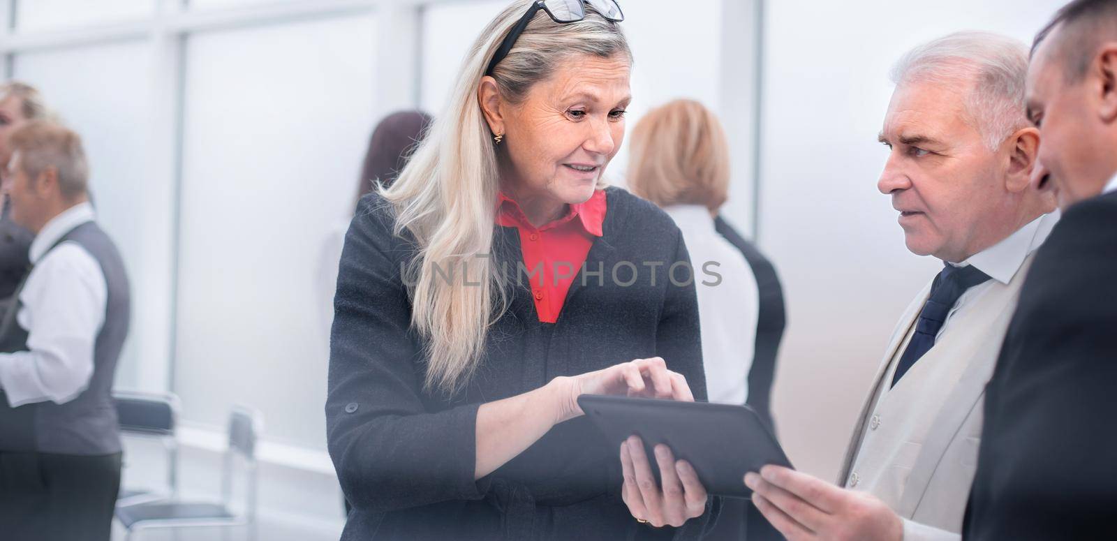 business people shaking hands before a meeting in the conference room by SmartPhotoLab