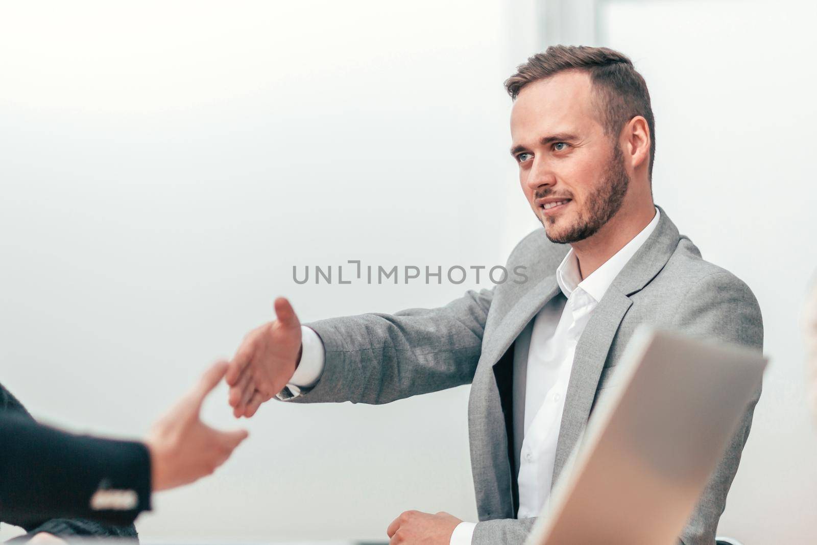 business people greeting each other with a handshake. by SmartPhotoLab