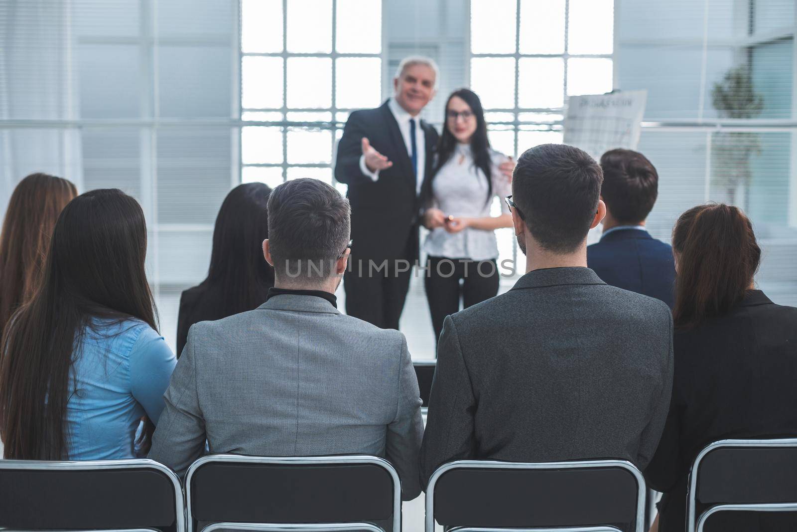 boss representing a young specialist during a work meeting. success concept