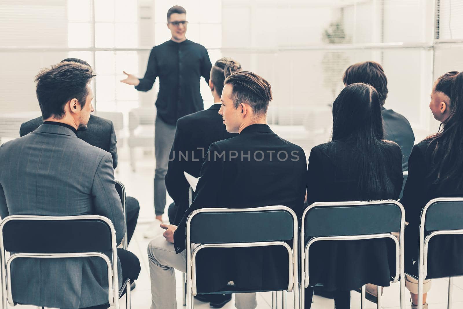 business team sitting in a conference room. by SmartPhotoLab