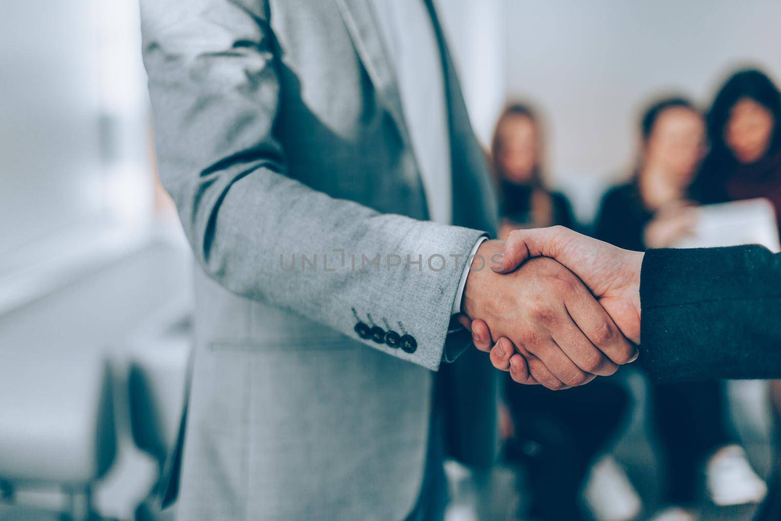 close up. handshake of business people in the office. by SmartPhotoLab