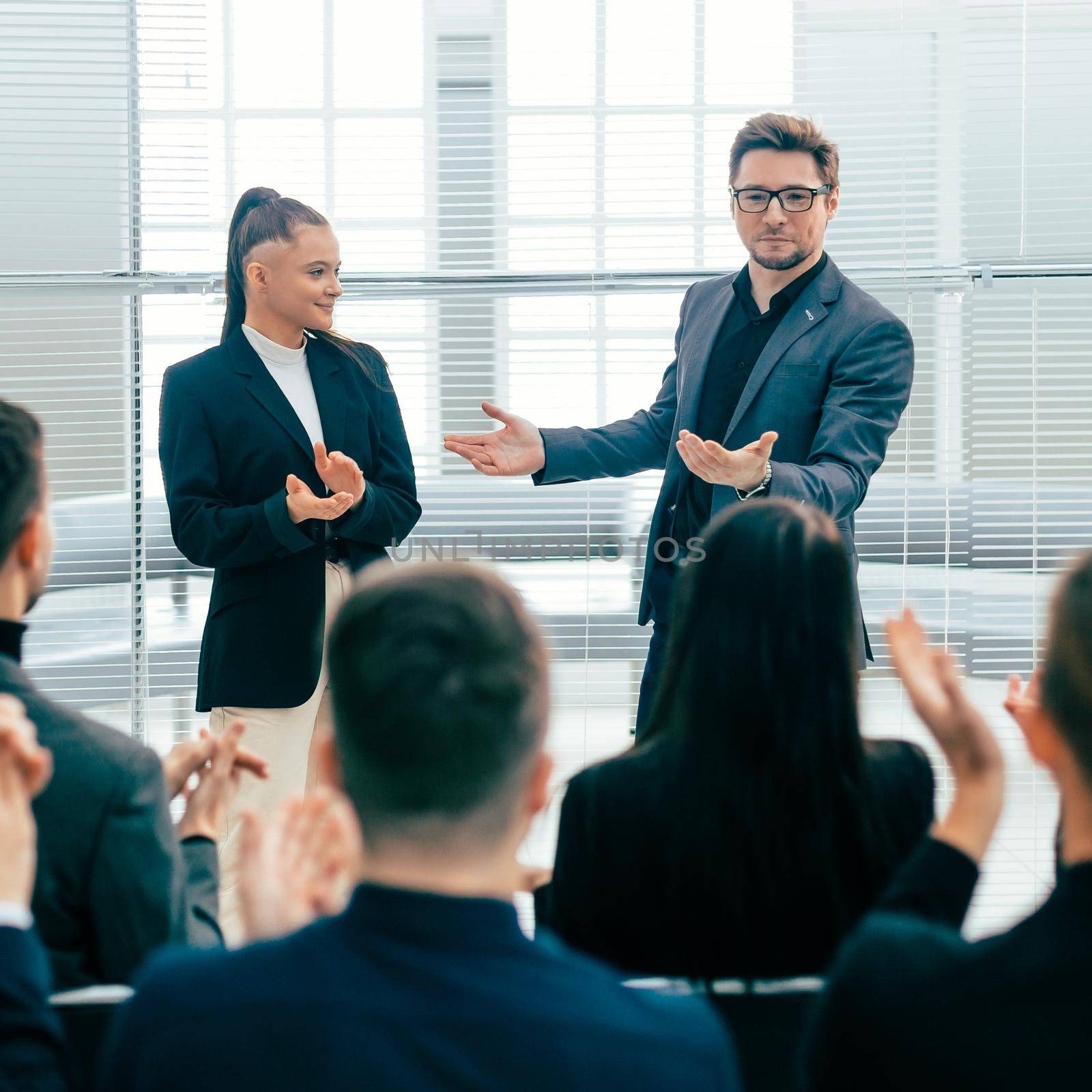 business team applauding at a work meeting. concept of success