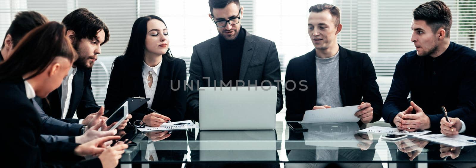 close up. the working group works with financial documents in the office.