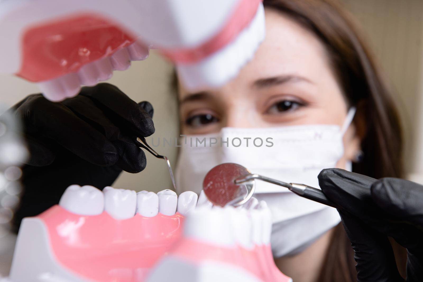 beautiful woman doctor with dental equipment in dentistry. High quality photo