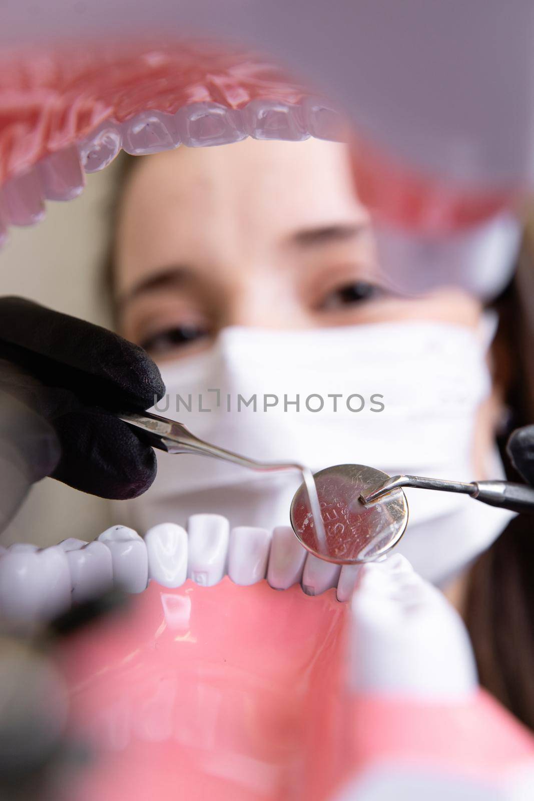 beautiful woman doctor with dental equipment in dentistry by yulikov