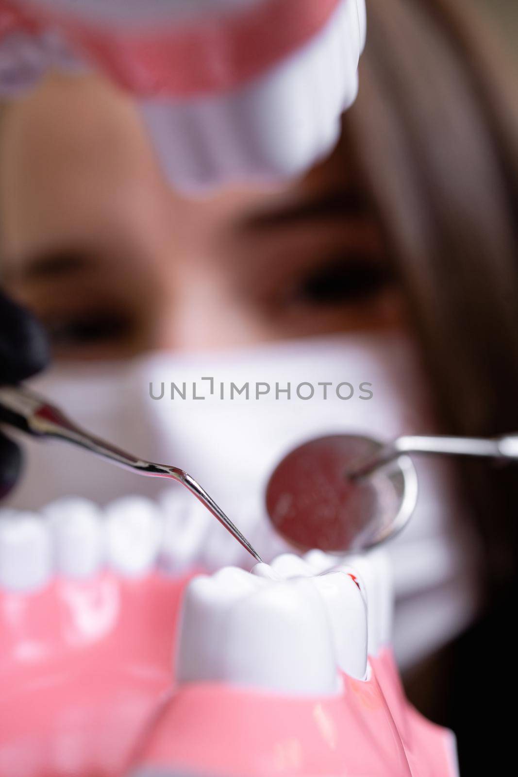 beautiful woman doctor with dental equipment in dentistry by yulikov