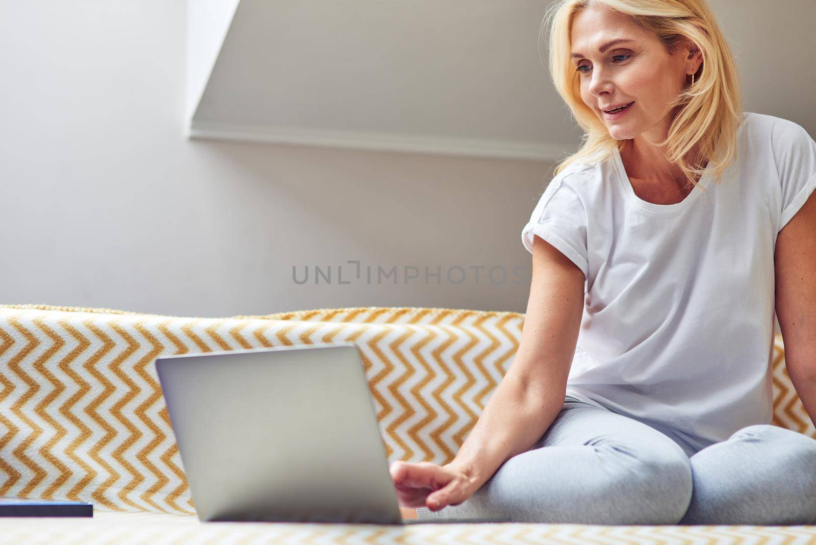 Middle aged caucasian woman working on laptop by friendsstock
