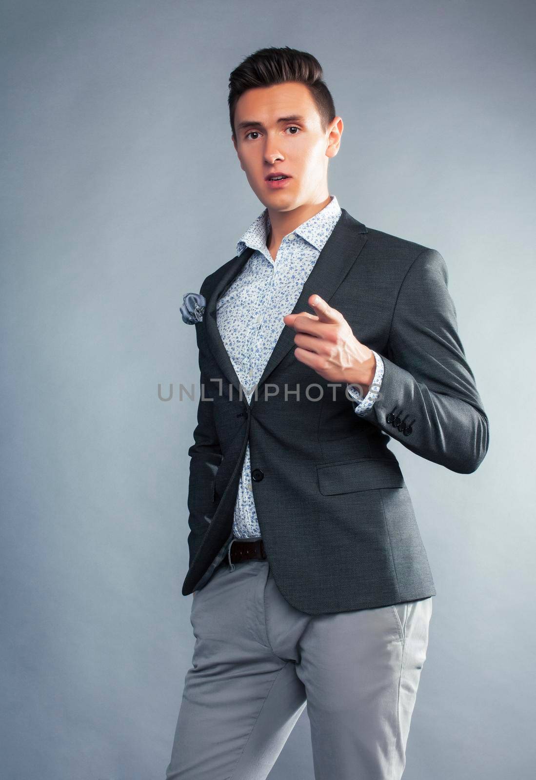young pretty businessman posing emotional gesturing on white background, lifestyle people concept by JordanJ
