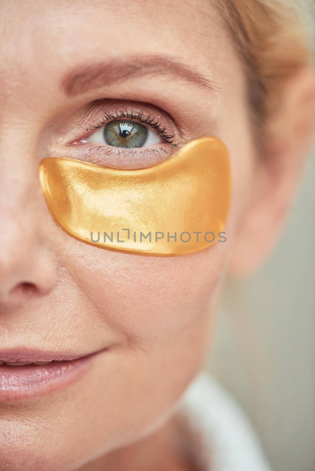 Middle aged caucasian woman half face with eye patch by friendsstock