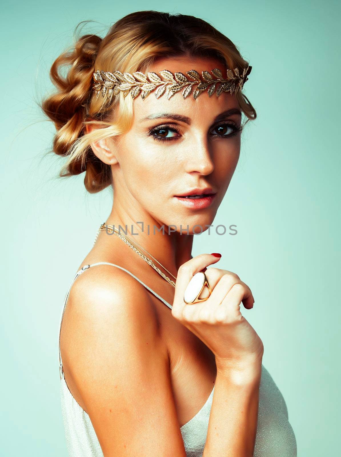 young blond woman dressed like ancient greek godess, gold jewelry close up isolated, beautiful girl hands manicured red nails by JordanJ