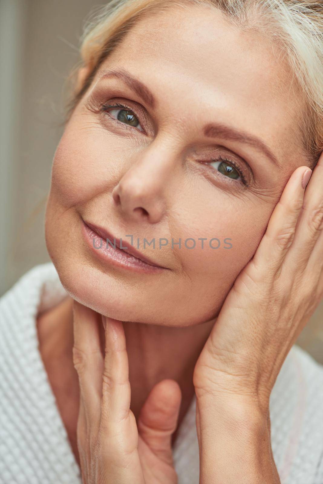 Beautiful middle aged caucasian woman during wellness procedures by friendsstock