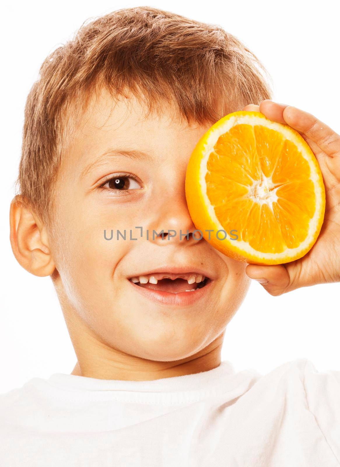 little cute boy with orange fruit double isolated on white smiling without front teeth adorable kid cheerful close up