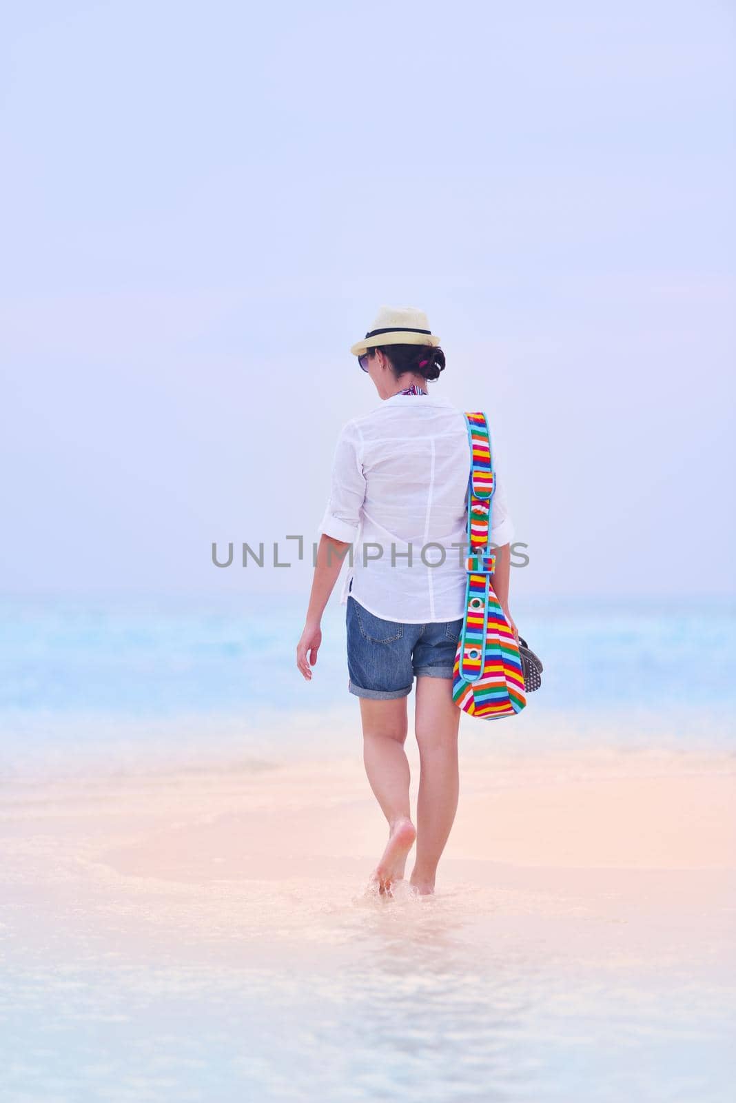 beautifel and happy woman girl on beach have fun and relax on summer vacation  over the beautiful tropical sea