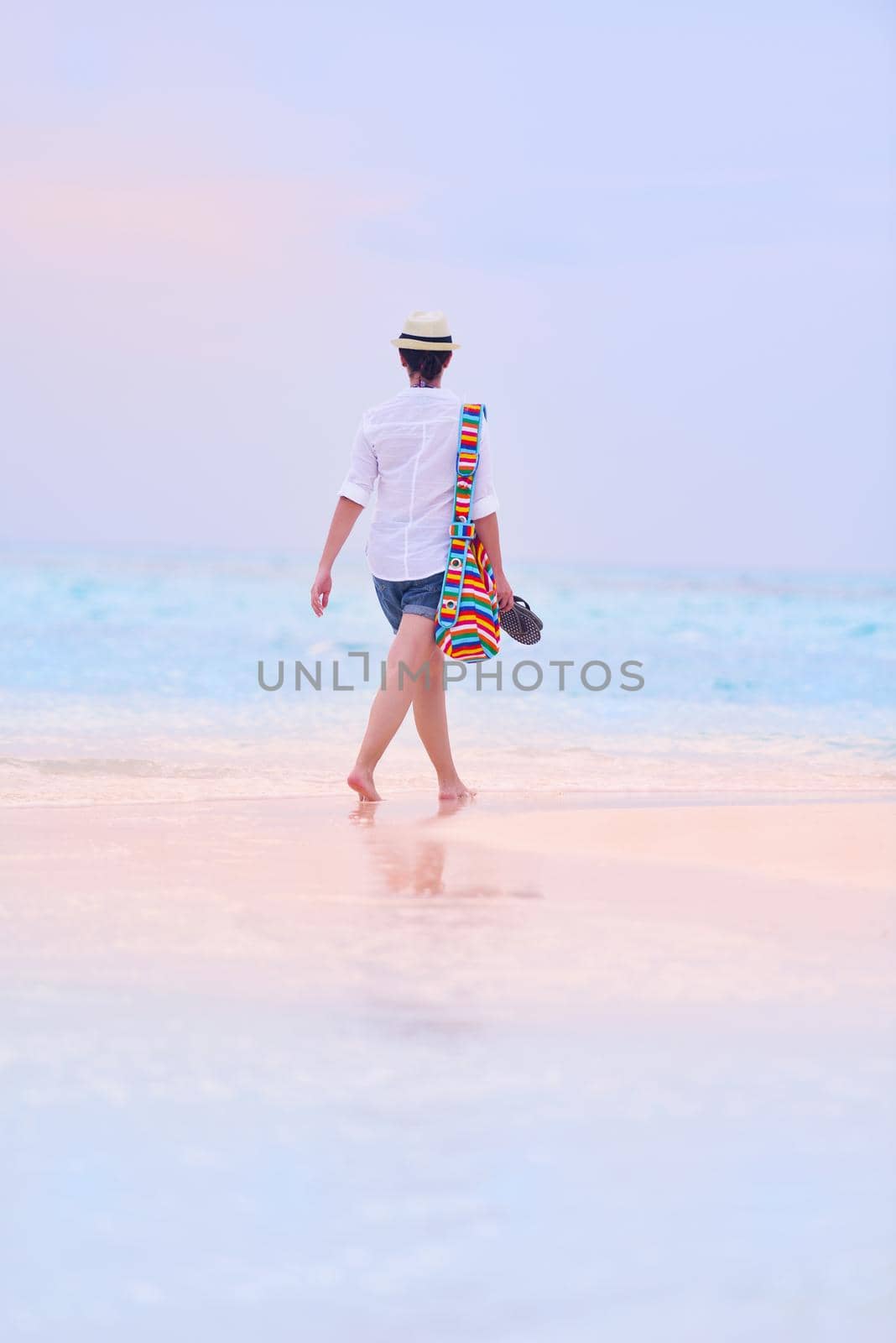 beautifel and happy woman girl on beach have fun and relax on summer vacation  over the beautiful tropical sea