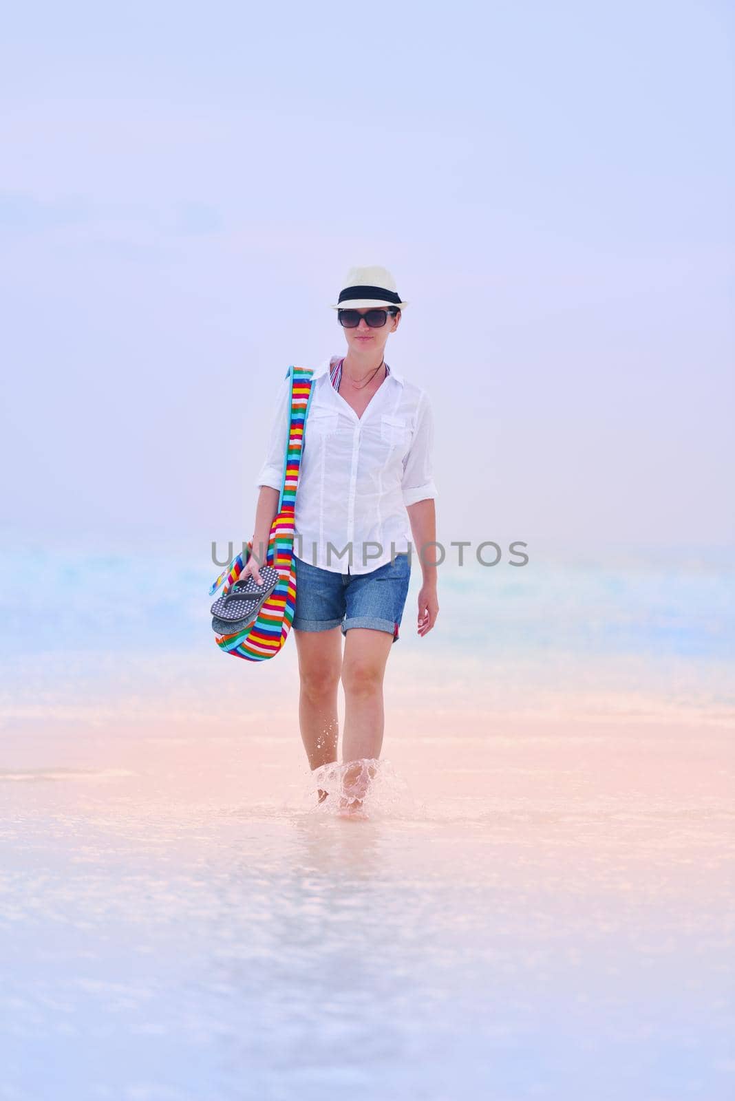 beautifel and happy woman girl on beach have fun and relax on summer vacation  over the beautiful tropical sea