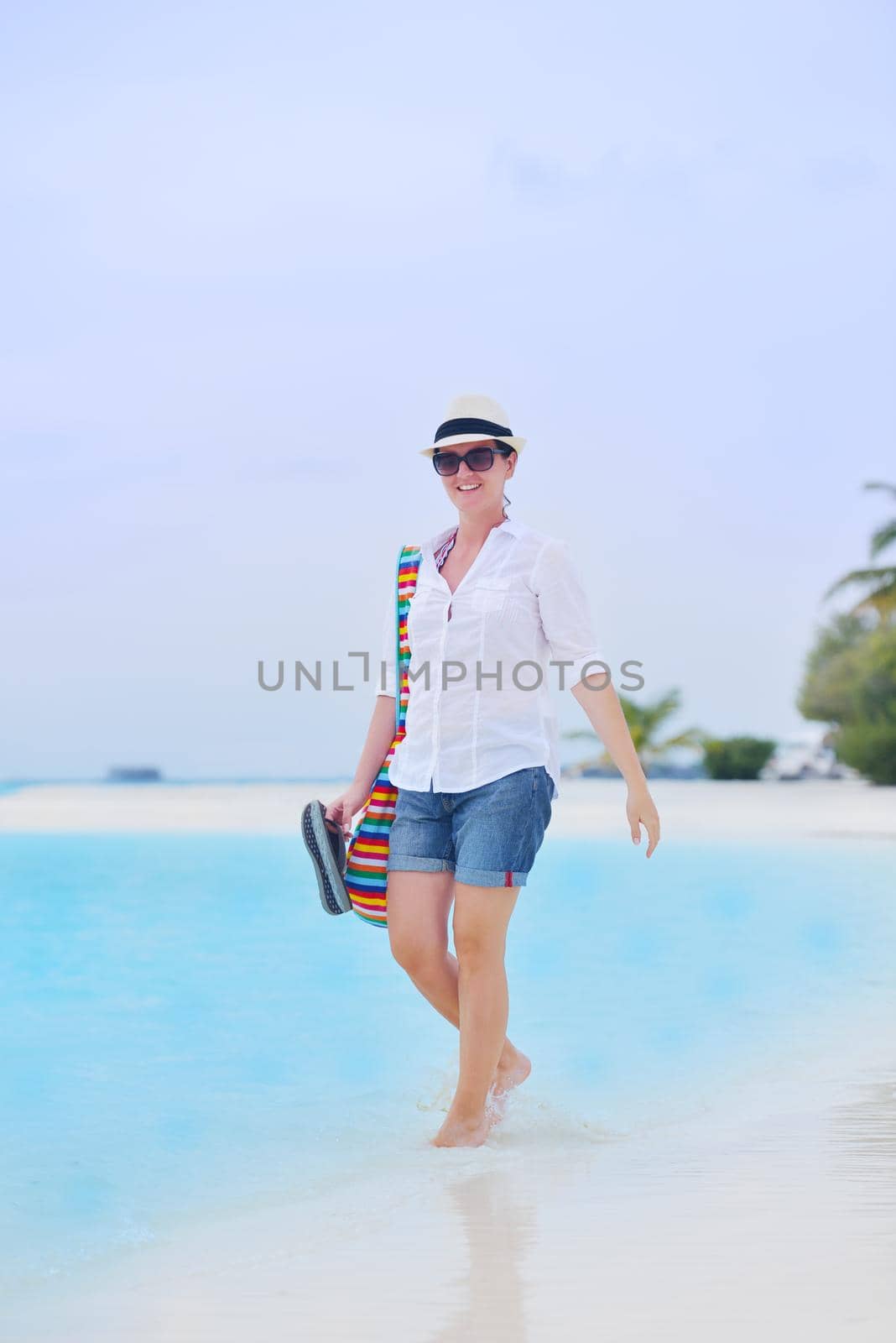 beautifel and happy woman girl on beach have fun and relax on summer vacation  over the beautiful tropical sea