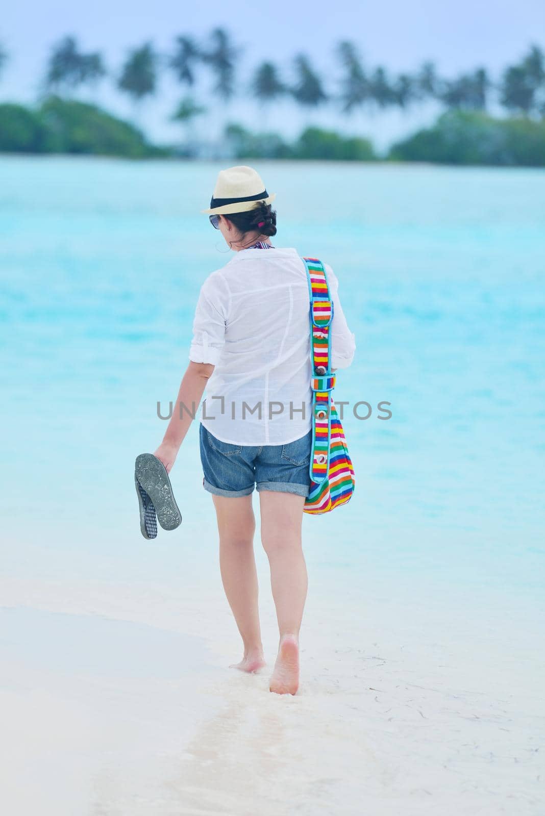 beautifel and happy woman girl on beach have fun and relax on summer vacation  over the beautiful tropical sea