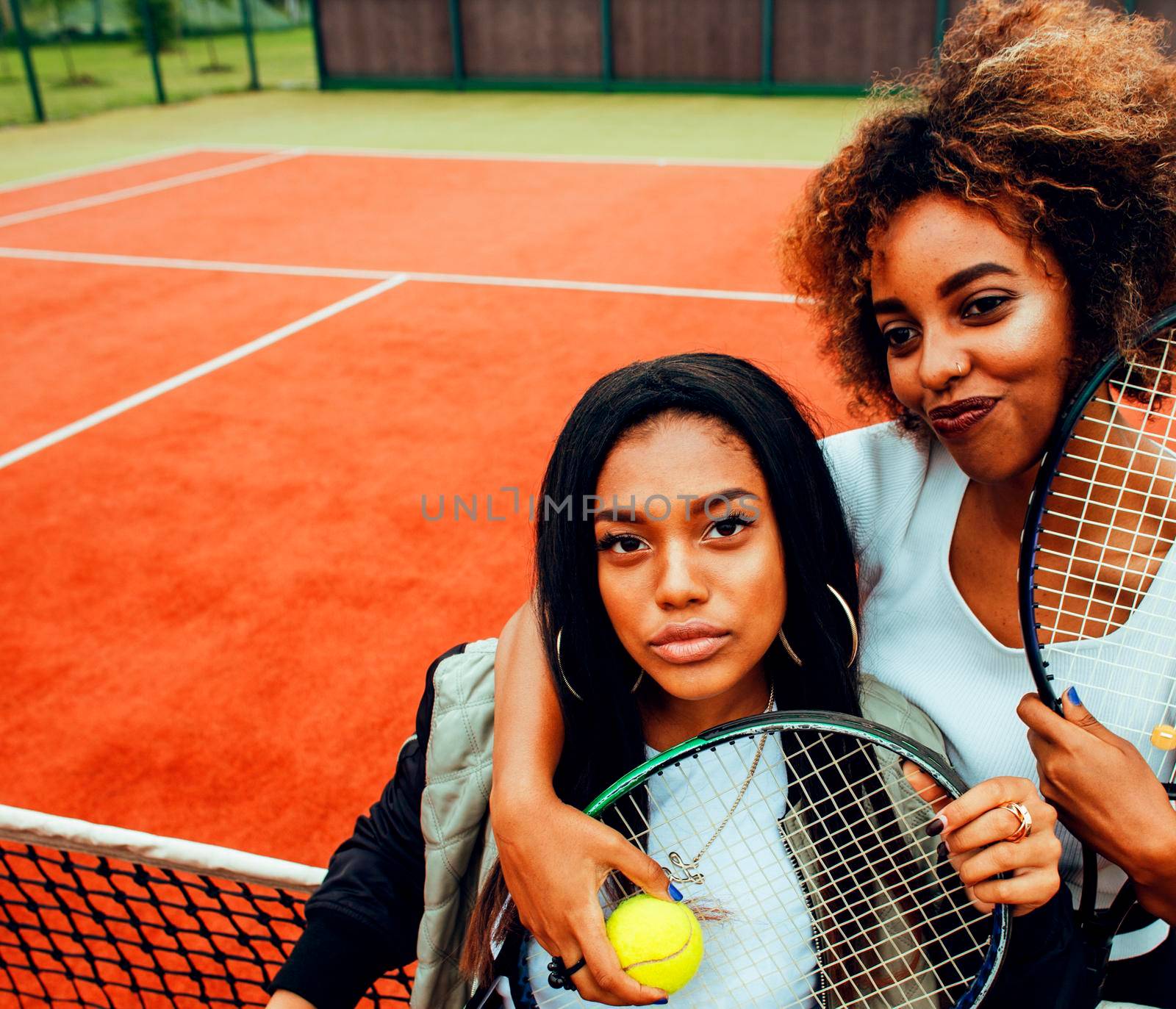 young pretty girlfriends hanging on tennis court, fashion stylish dressed swag, best friends happy smiling together lifestyle by JordanJ