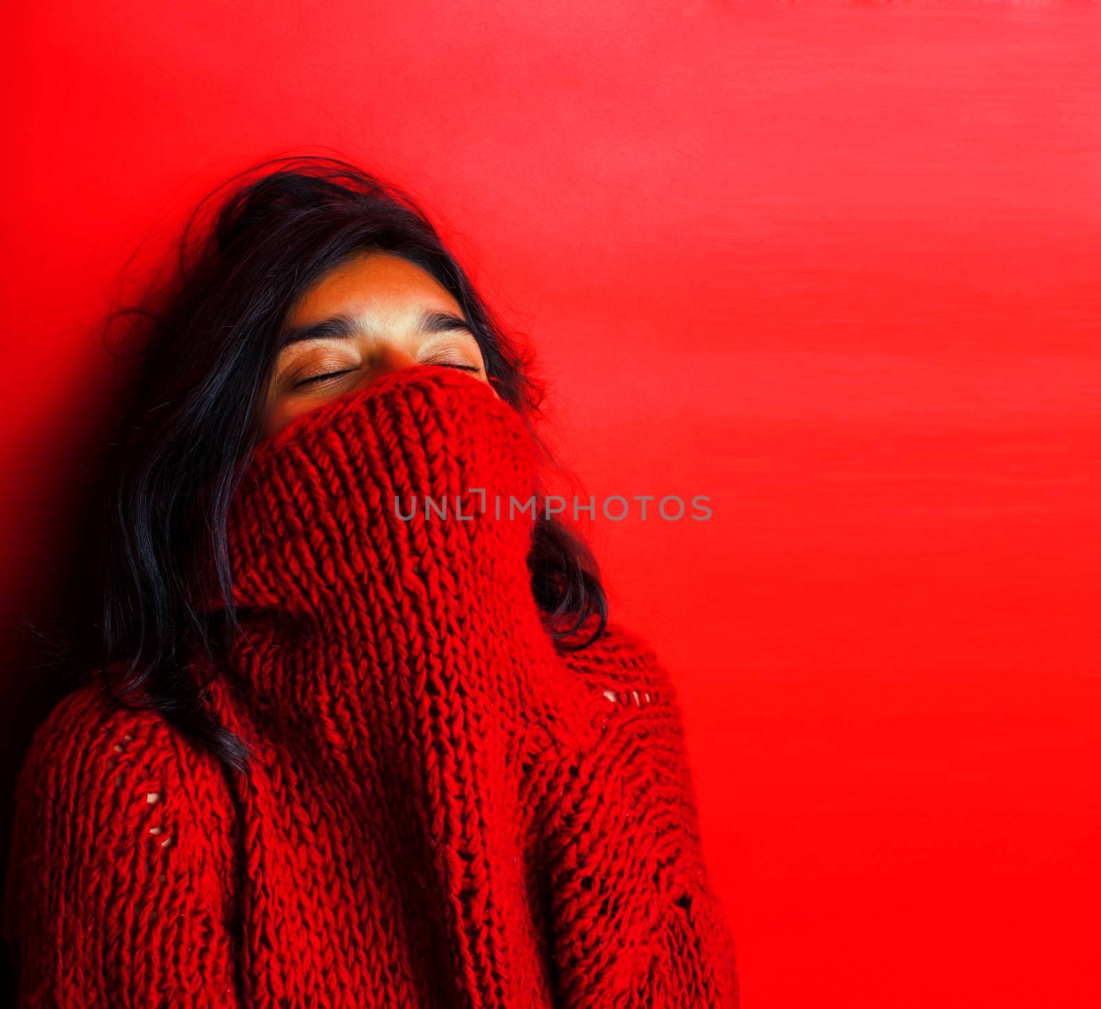 young pretty indian girl in red sweater posing emotional, fashion hipster teenage, lifestyle people concept by JordanJ