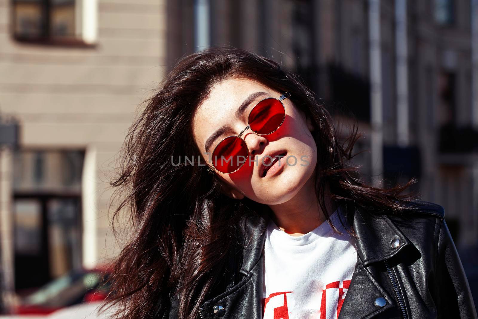 young pretty asian girl wearing sunglasses outside on big city street, lifestyle people concept close up