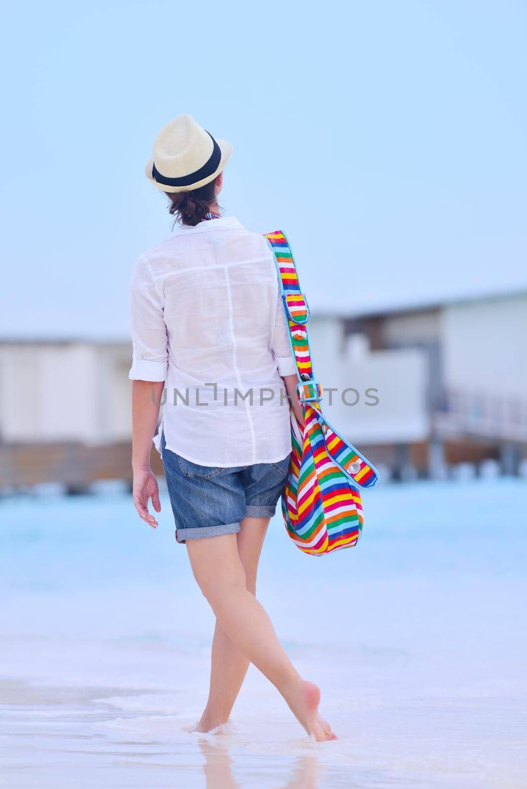 beautiful and happy woman girl on beach have fun and relax on summer vacation  over the sea