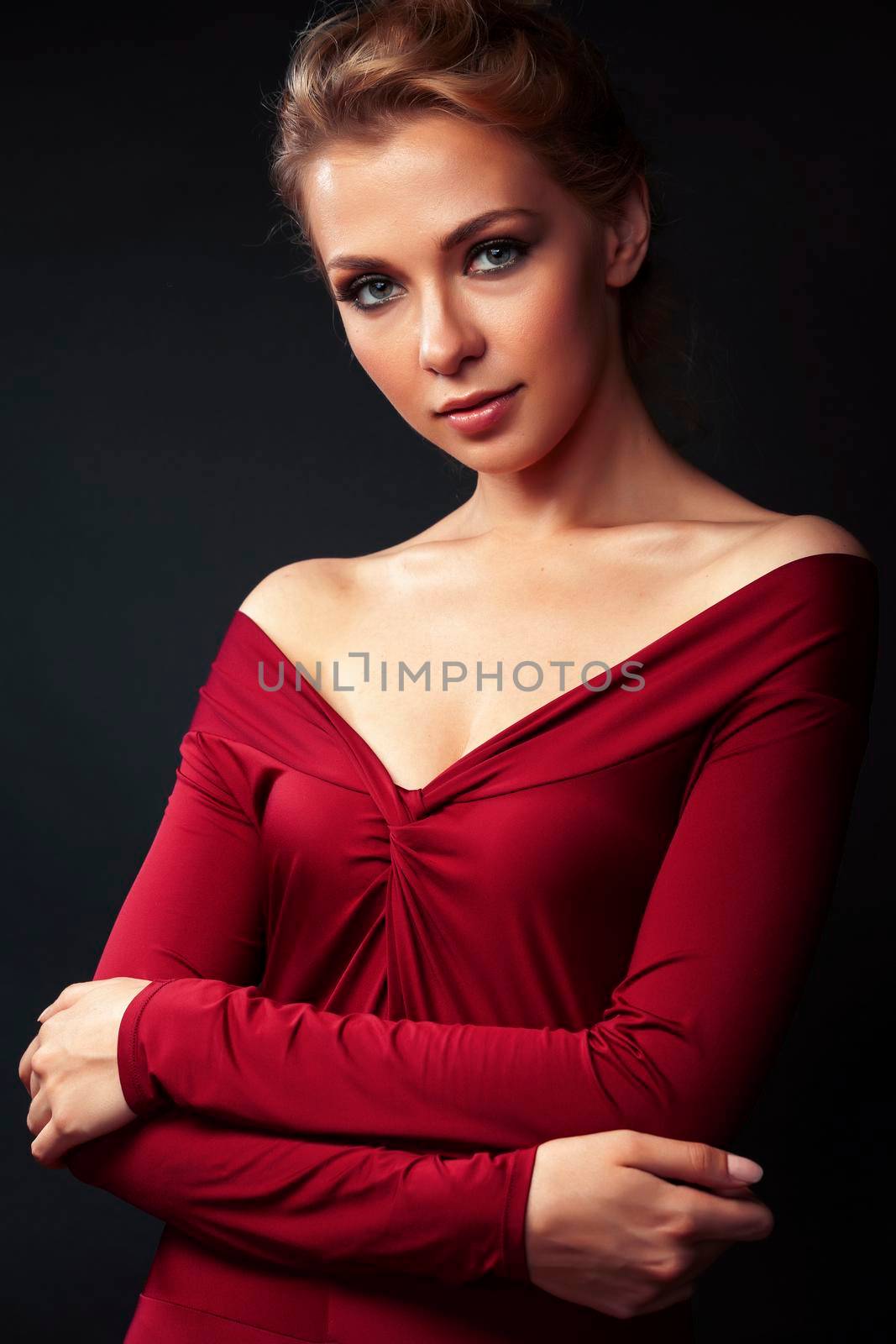 young sensual blond woman posing on black background, lifestyle people concept close up