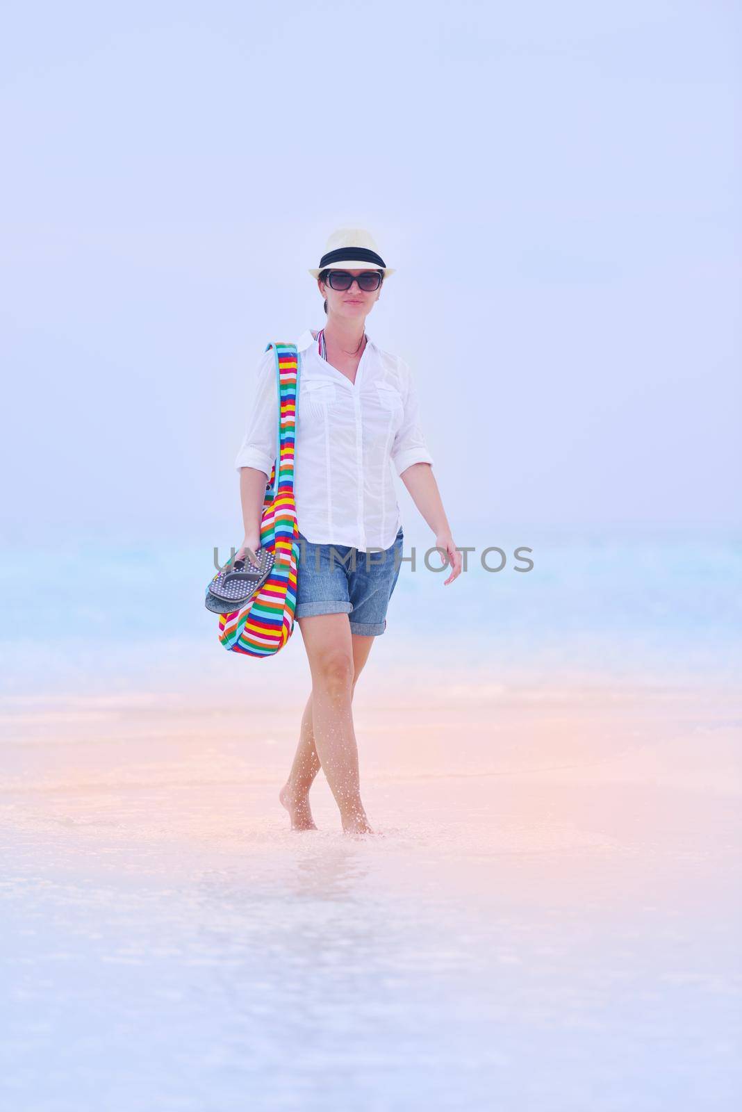 beautifel and happy woman girl on beach have fun and relax on summer vacation  over the beautiful tropical sea