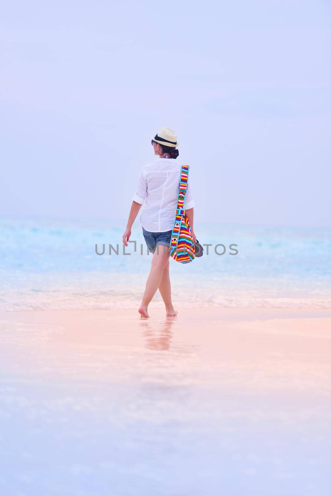 beautifel and happy woman girl on beach have fun and relax on summer vacation  over the beautiful tropical sea