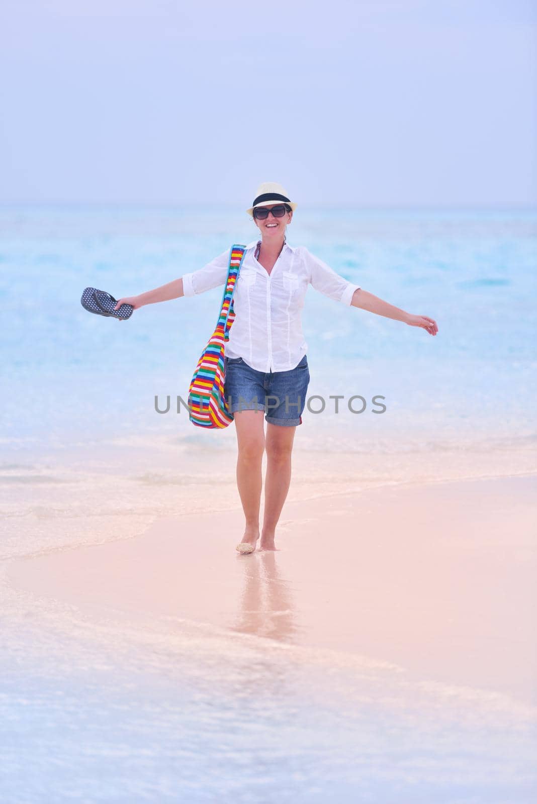 beautifel and happy woman girl on beach have fun and relax on summer vacation  over the beautiful tropical sea