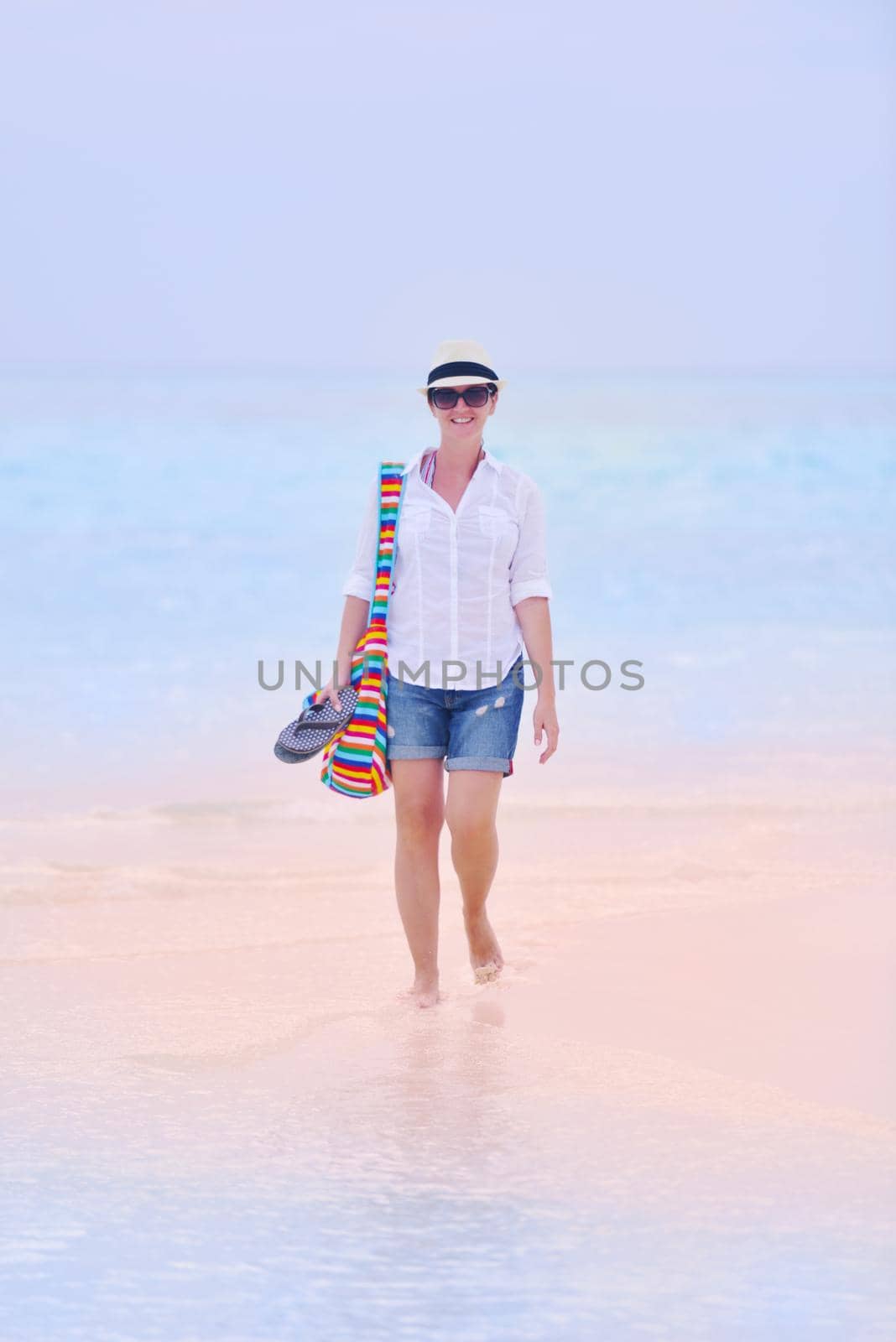 beautifel and happy woman girl on beach have fun and relax on summer vacation  over the beautiful tropical sea