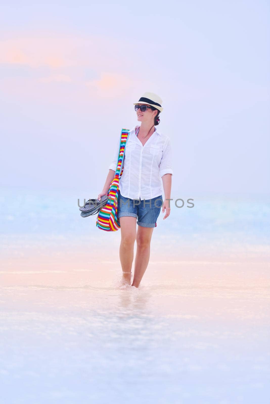 beautifel and happy woman girl on beach have fun and relax on summer vacation  over the beautiful tropical sea