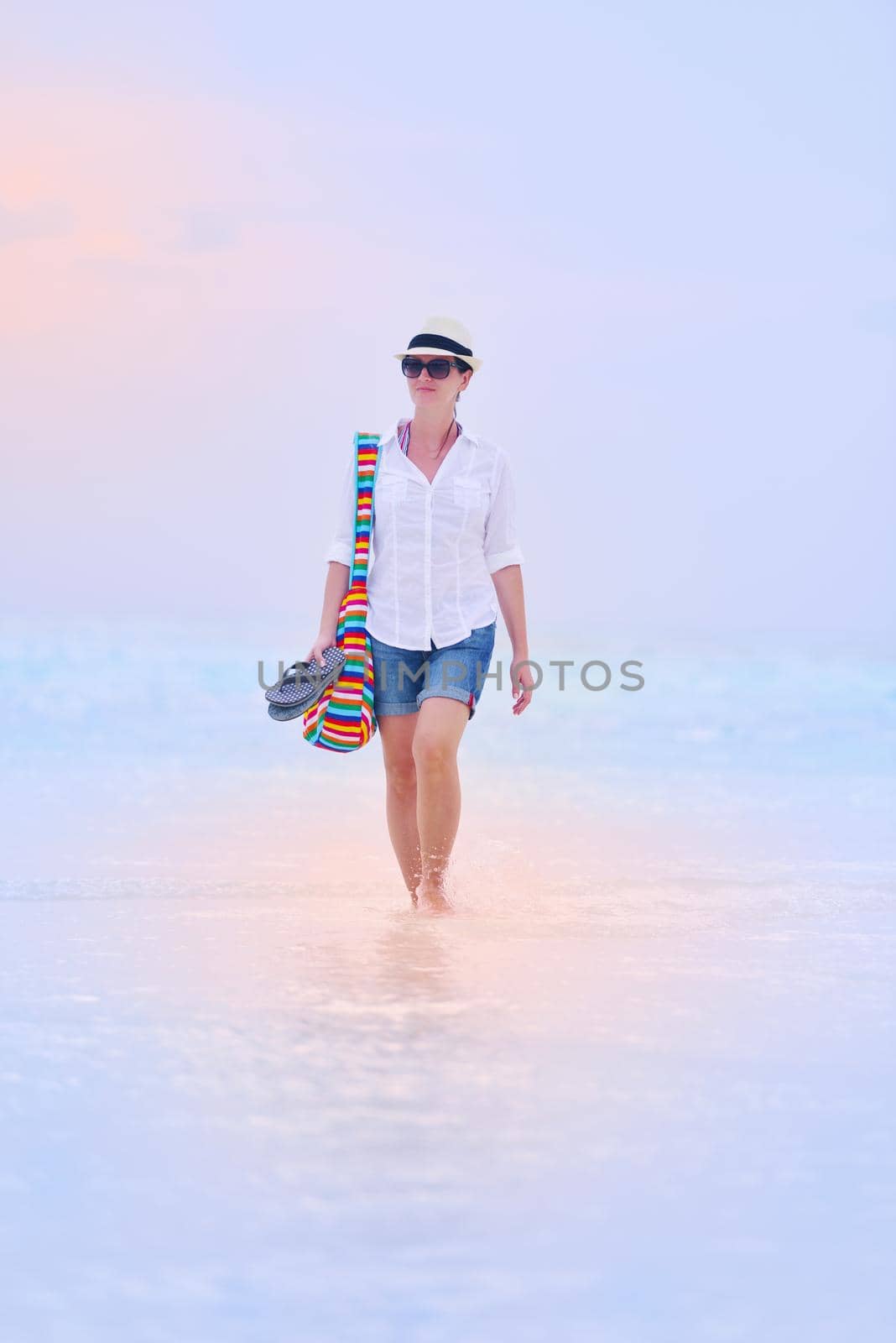 beautifel and happy woman girl on beach have fun and relax on summer vacation  over the beautiful tropical sea