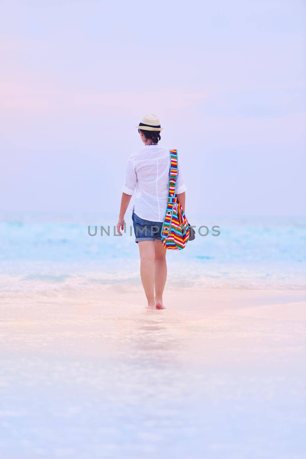 beautifel and happy woman girl on beach have fun and relax on summer vacation  over the beautiful tropical sea