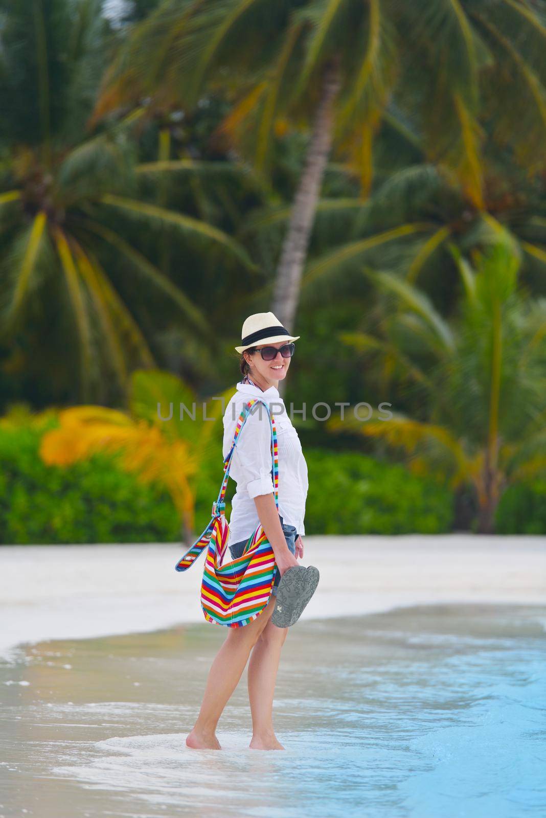 beautifel and happy woman girl on beach have fun and relax on summer vacation  over the beautiful tropical sea