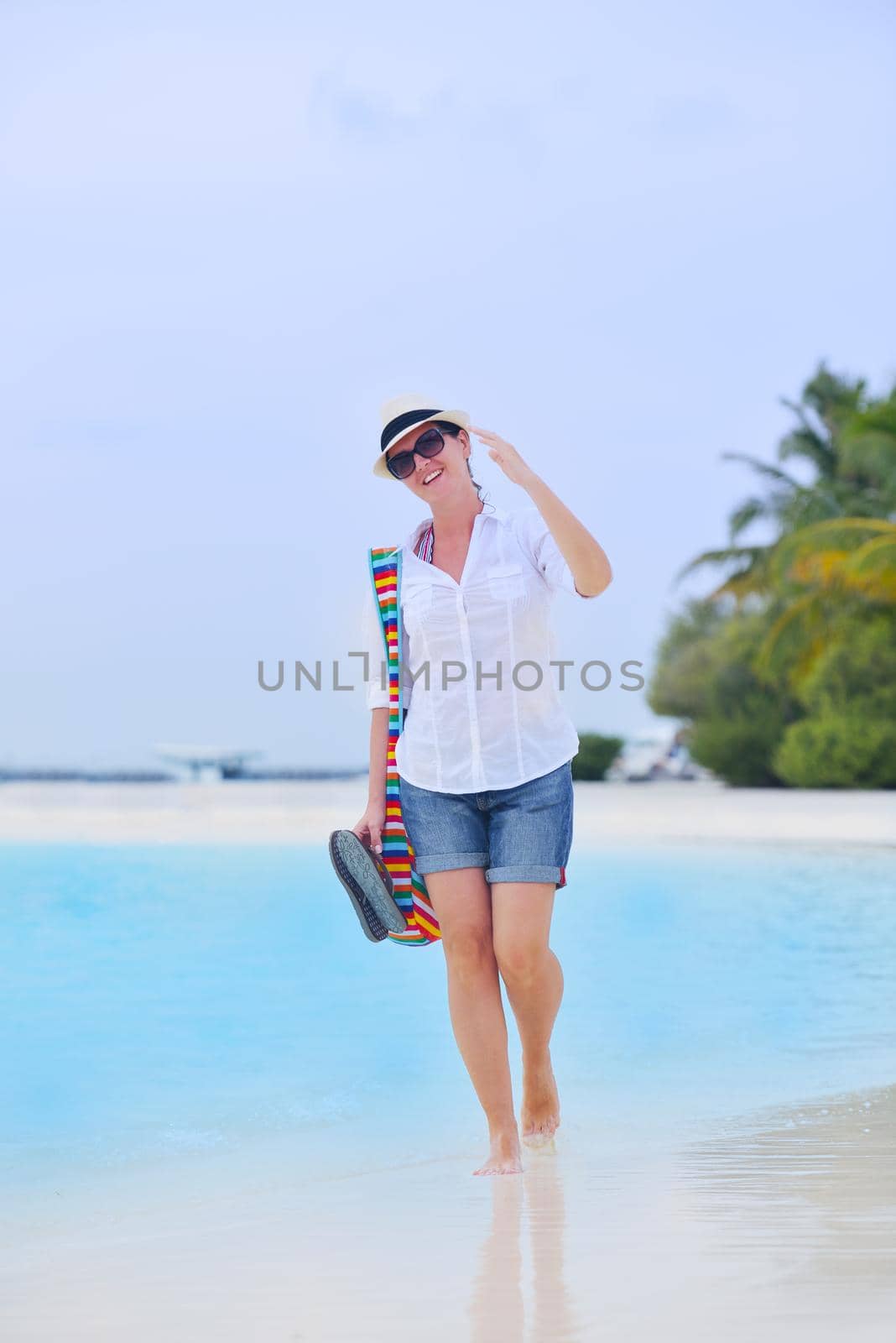 beautifel and happy woman girl on beach have fun and relax on summer vacation  over the beautiful tropical sea