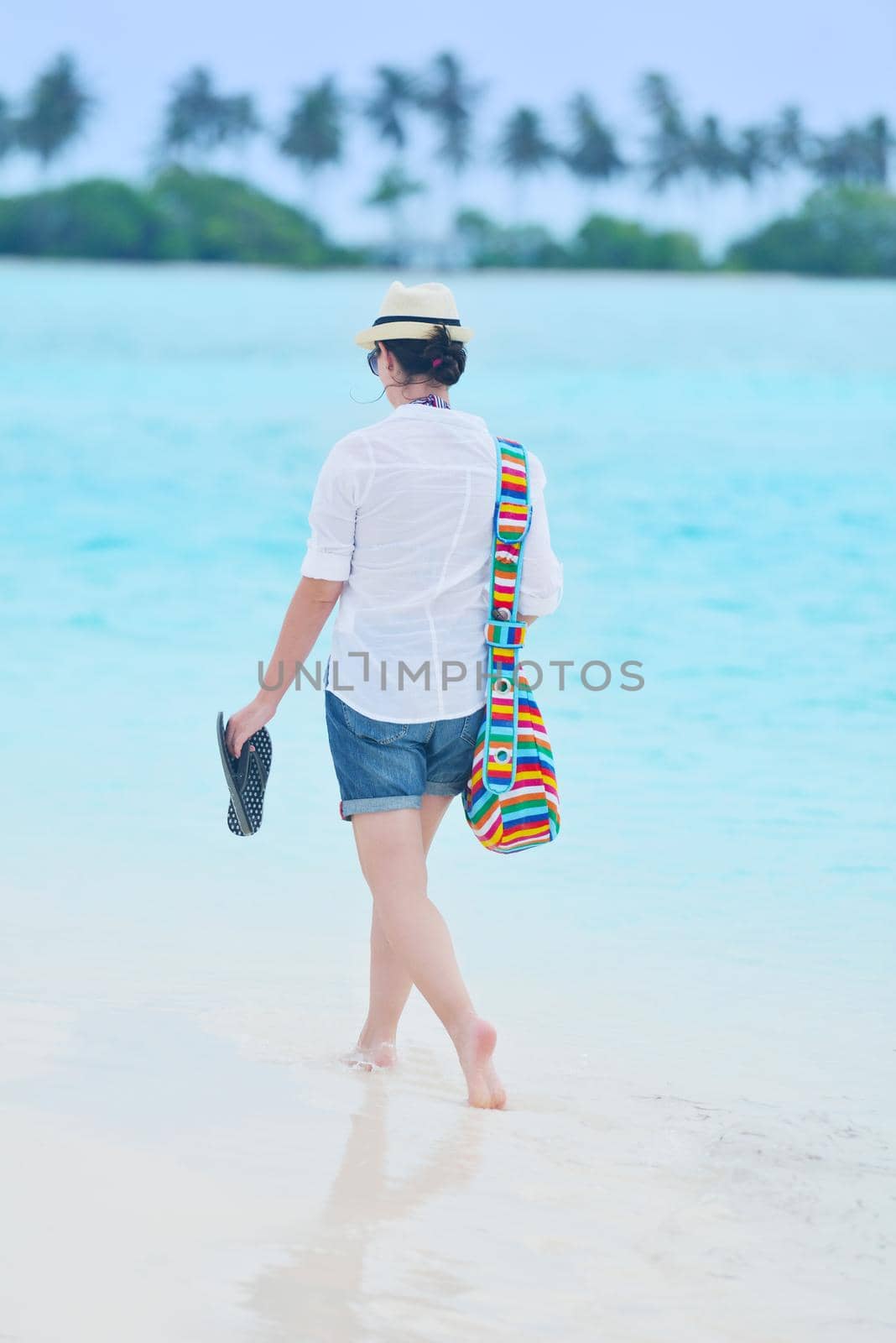 beautifel and happy woman girl on beach have fun and relax on summer vacation  over the beautiful tropical sea