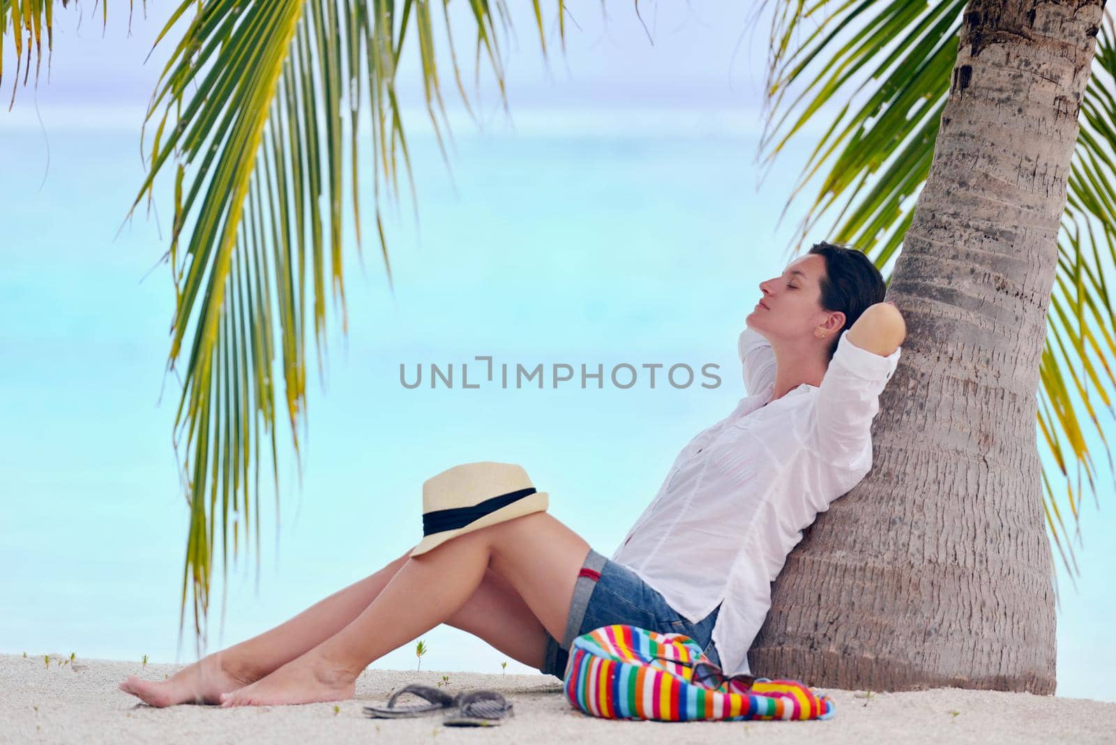 beautifel and happy woman girl on beach have fun and relax on summer vacation  over the beautiful tropical sea