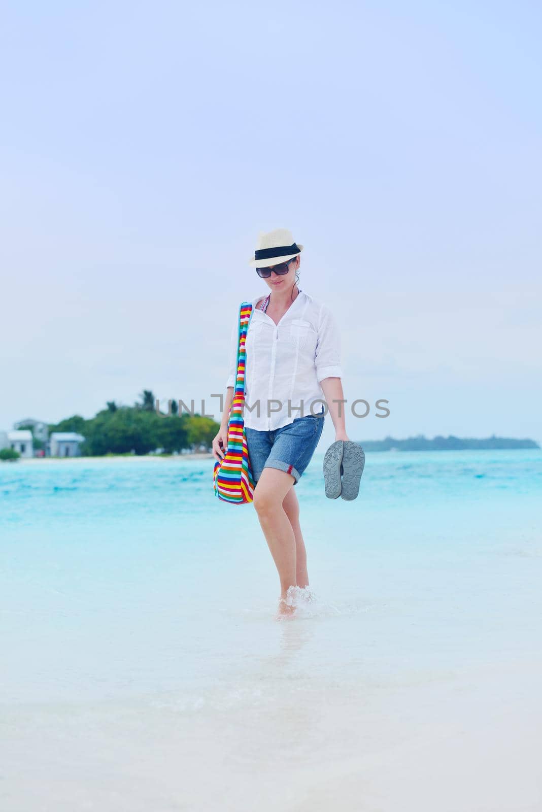 beautifel and happy woman girl on beach have fun and relax on summer vacation  over the beautiful tropical sea